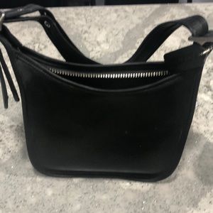 Very gently used authentic coach purse. Maybe used three times.